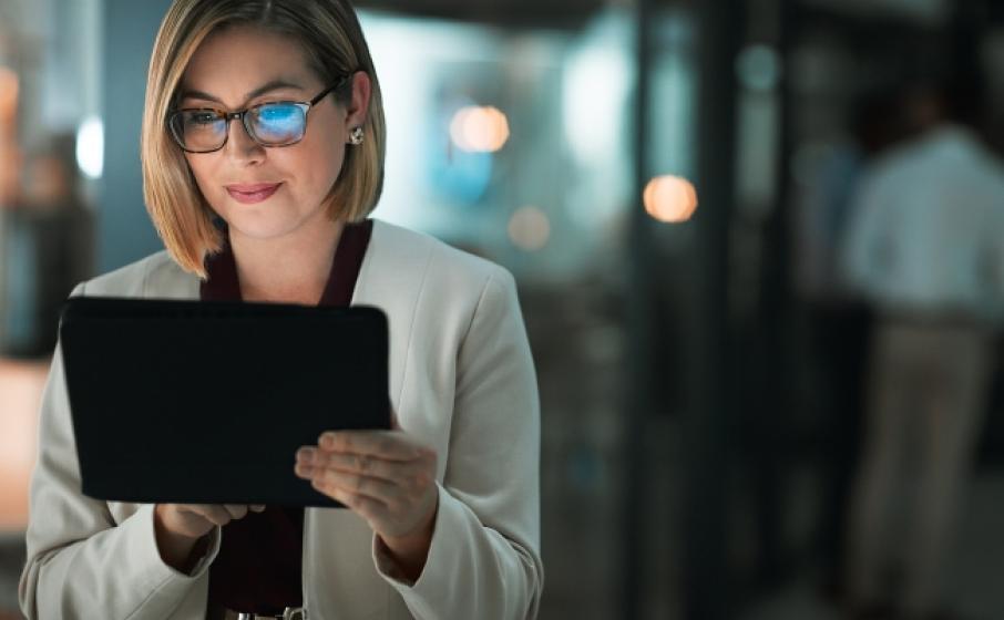 An executive working on a tablet.