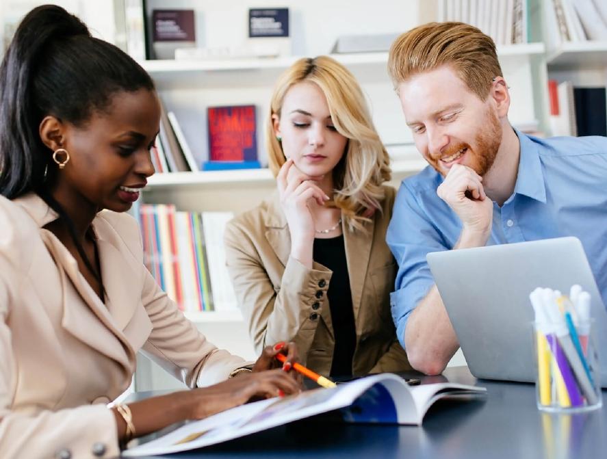 Program benefits people looking at pamphlet