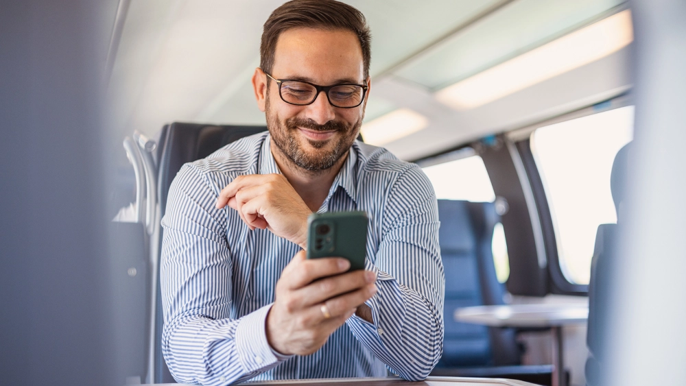 Two woman in an office staring at a computer screen